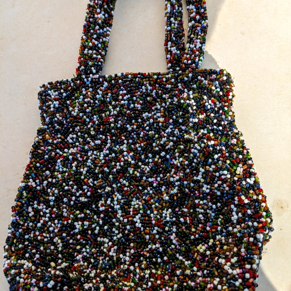 Small Moyna brand  multi beaded purse. Silk inside.
